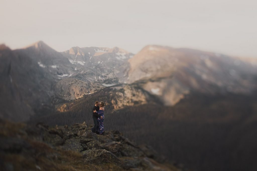 Colorado couple in adventurous alpine surroundings at the top at 12000 feet