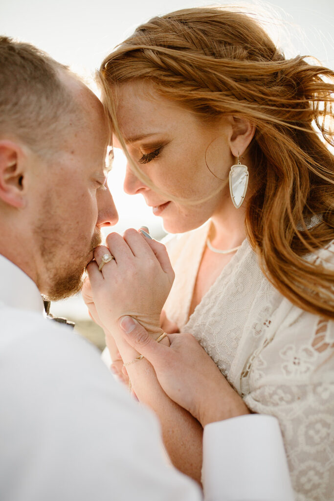 Brett and Laura celebrating their love during an adventurous Rocky Mountain National Park engagement session.