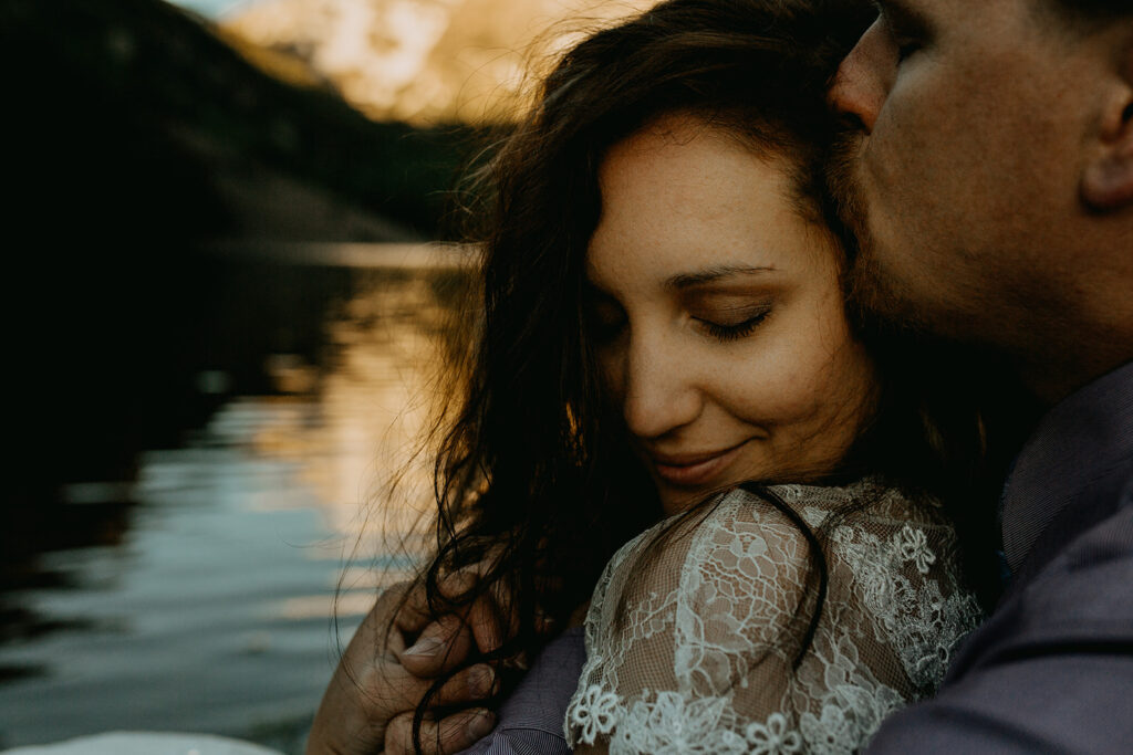 Amy and Ian sharing a quiet moment along the shores of Maroon Lake