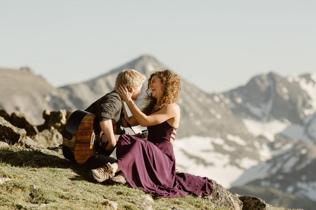 Oliver and Alyssa embracing on an alpine overlook in Colorado