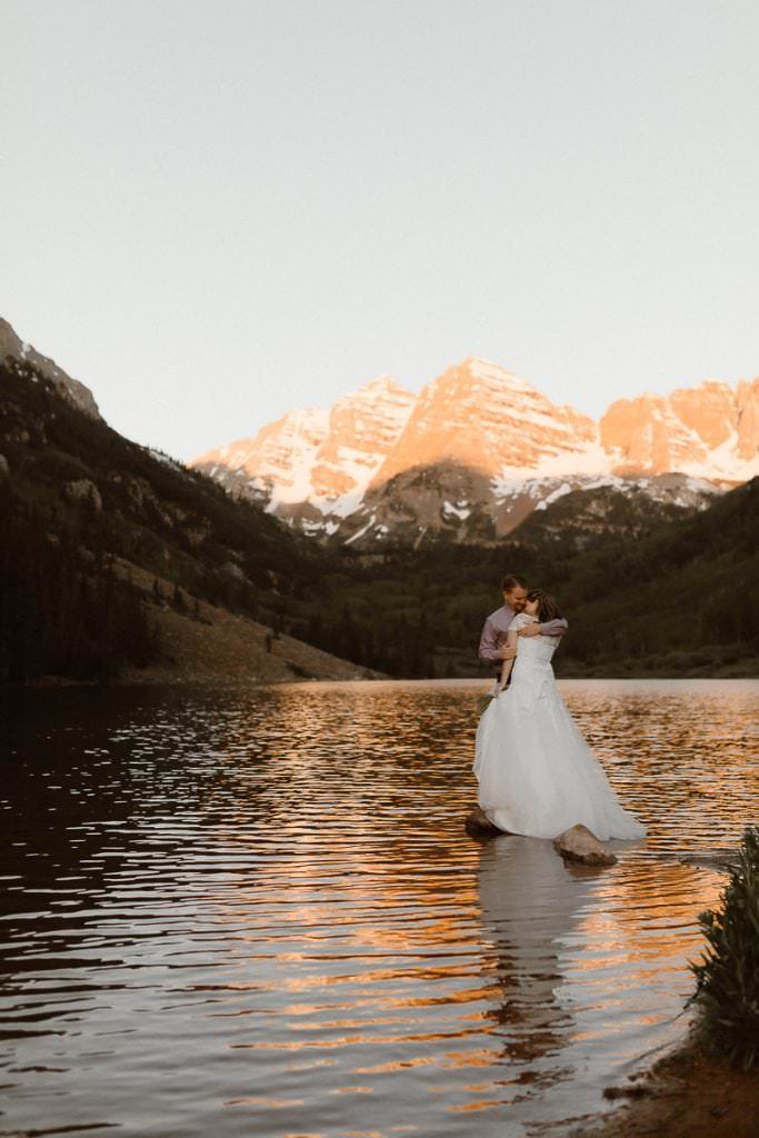 Amy and Ian embracing at Maroon Bells during their Aspen elopement