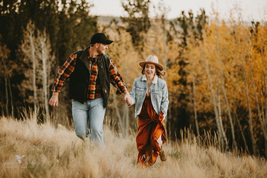 Adventure engagement portraits with breathtaking fall mountain views in Colorado