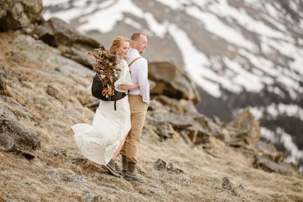 Adventurous couple exploring one of Colorado's most scenic mountain roads at sunset.