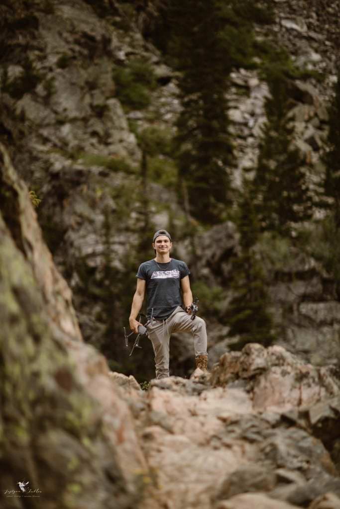 Robert Jess, Justyna's son and her drone assistant on an alpine trail among rocky cliffs in Steamboat Springs, Colorado hiking waterfalls and chasing light. Justyna E Butler Photography: Elopement Photographers in Denver, CO