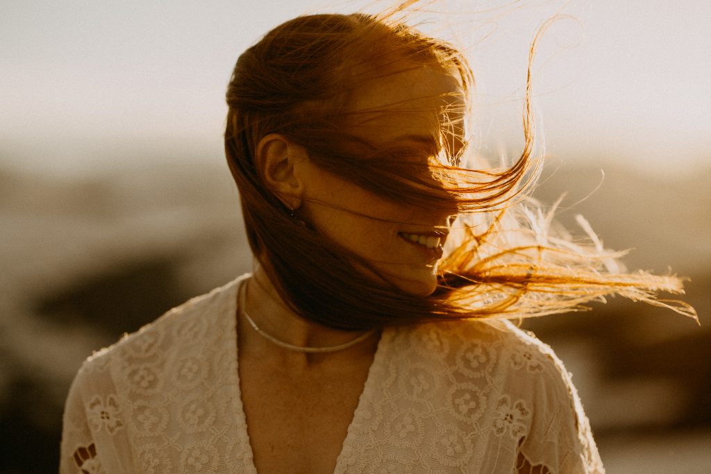Wind blowing through the bride's hair as the couple enjoys golden hour in Rocky Mountain National Park.