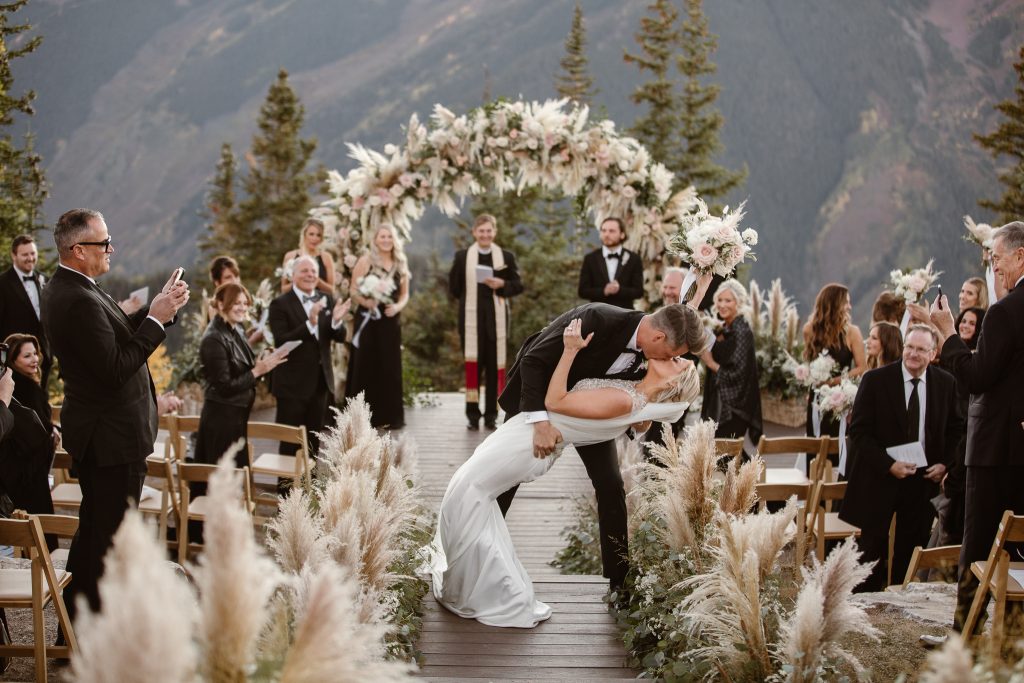 Bride walking down the aisle with her father at The Little Nell Aspen wedding