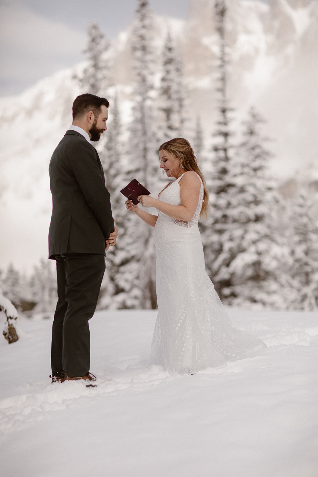 Emotional vow exchange surrounded by fresh June snowfall
