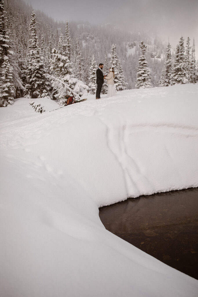 Sunrise adventure elopement on a snowy trail in Rocky Mountain National Park