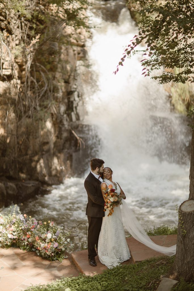 This Woodlands Fairytale At Copper Waterfalls captured by Justyna E Butler, best Colorado Wedding Photographers