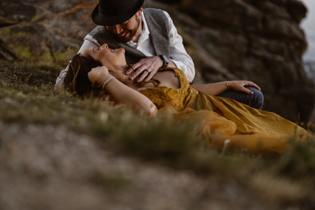 Colorado elopement photographer captures intimate mountain adventure wedding at golden hour, bride in flowing yellow dress with groom.