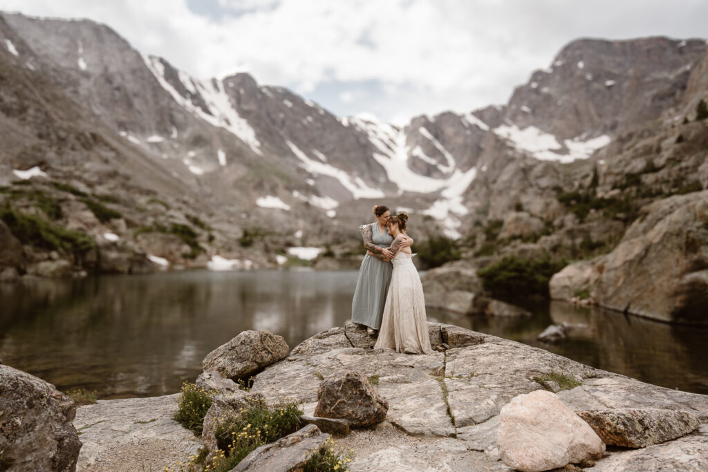 Adventure elopement inspiration in the Colorado Rockies. This romantic wedding photography captures a bride and groom overlooking sweeping alpine views, ideal for couples who want to elope in nature.