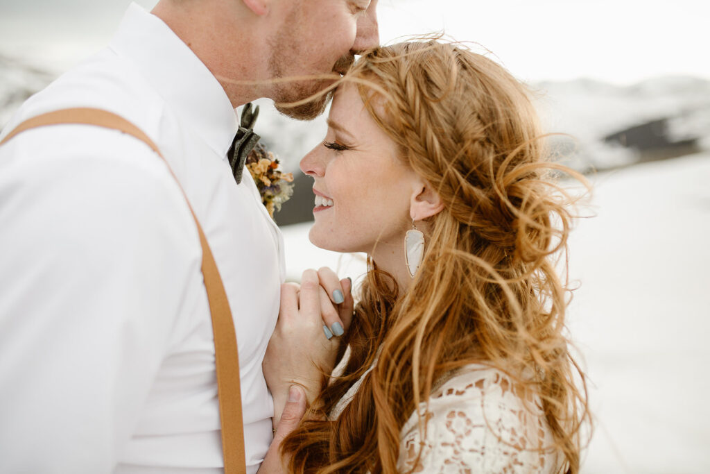 Justyna E. Butler, Colorado Elopement Photographer specializing in cinematic adventure elopements, hiking elopements, intimate weddings in the Rocky Mountains of Colorado & Worldwide