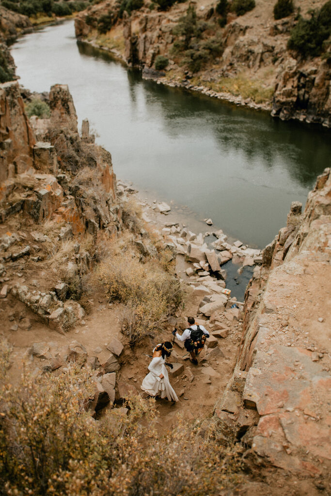 Bride and groom enjoying a romantic hike to hot springs soak during their Breckenridge elopement weekend.