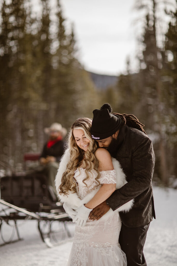 Romantic Breckenridge elopement portraits surrounded by evergreen forests covered in snow.