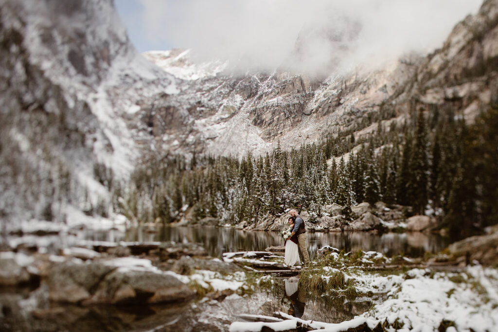 An adventurous Colorado elopement surrounded by breathtaking mountain scenery, capturing the couple's connection, genuine emotions, and the beauty of their wedding day in the Rocky Mountains.