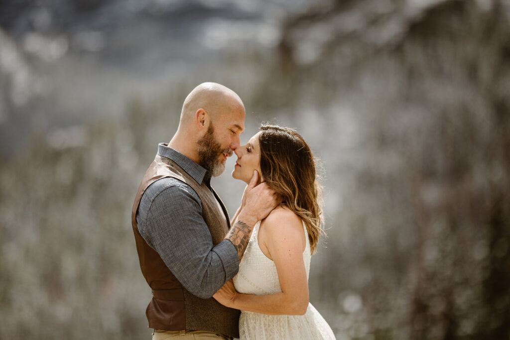Christime + Jason exchanging vows during their Colorado mountain elopement