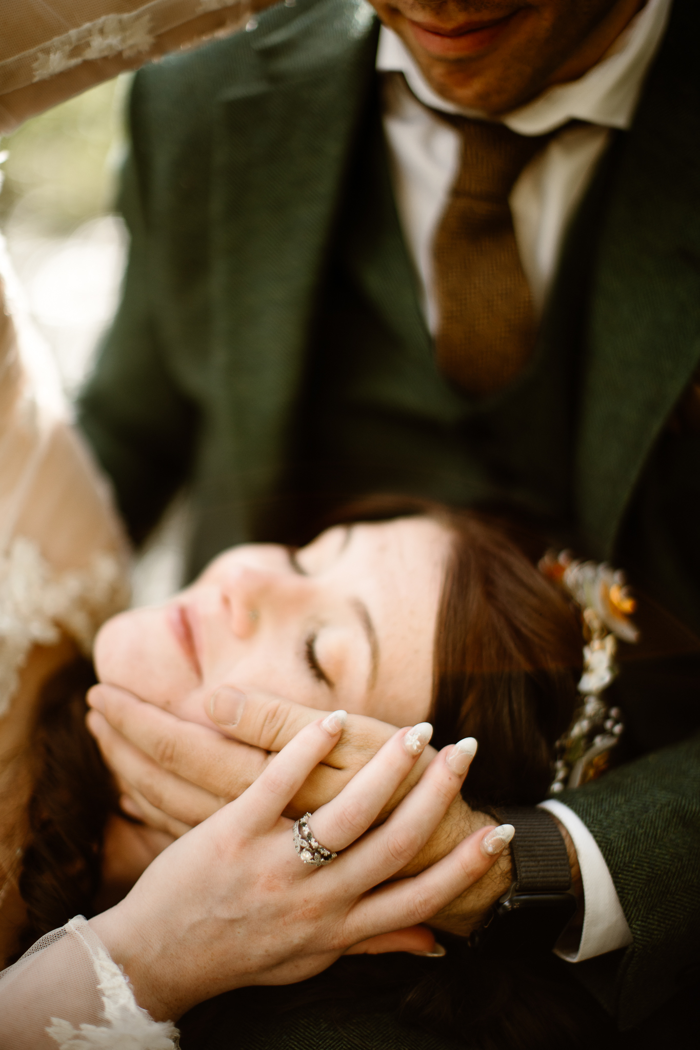 Close-up of newlyweds embracing during a luxury Colorado adventure elopement.
