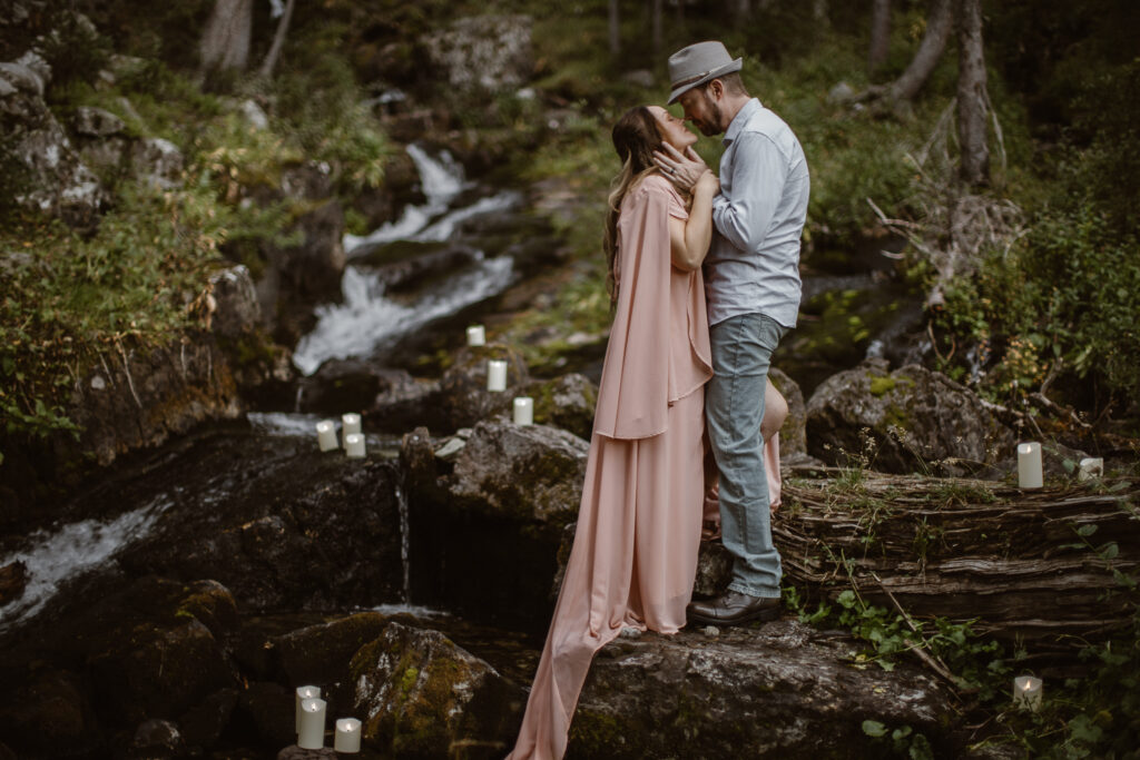 Crested Butte waterfall elopement surrounded by lush mountain forest.